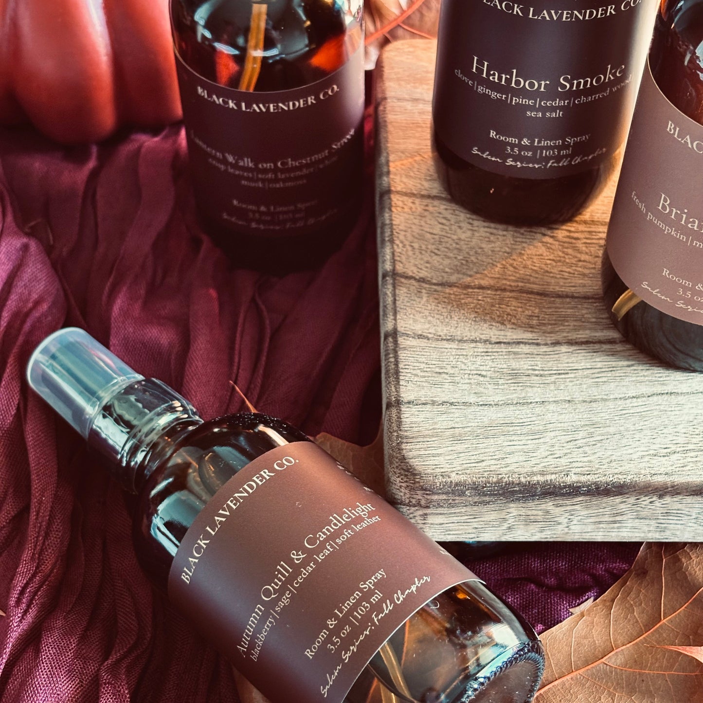 A styled flat-lay of Black Lavender Co. home fragrance products, featuring a spray bottle of room and linen spray